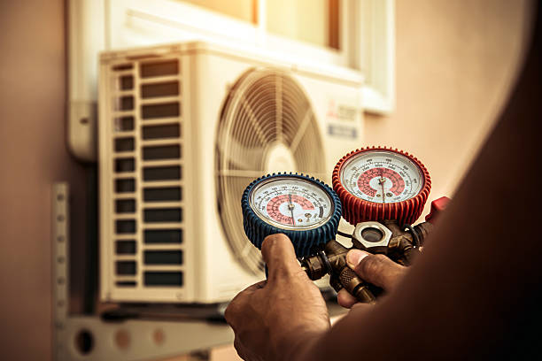 Professional Heat Pump Repair technician working in Providence, KY